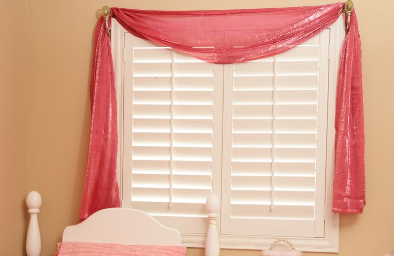 Kid's room with white shutters.